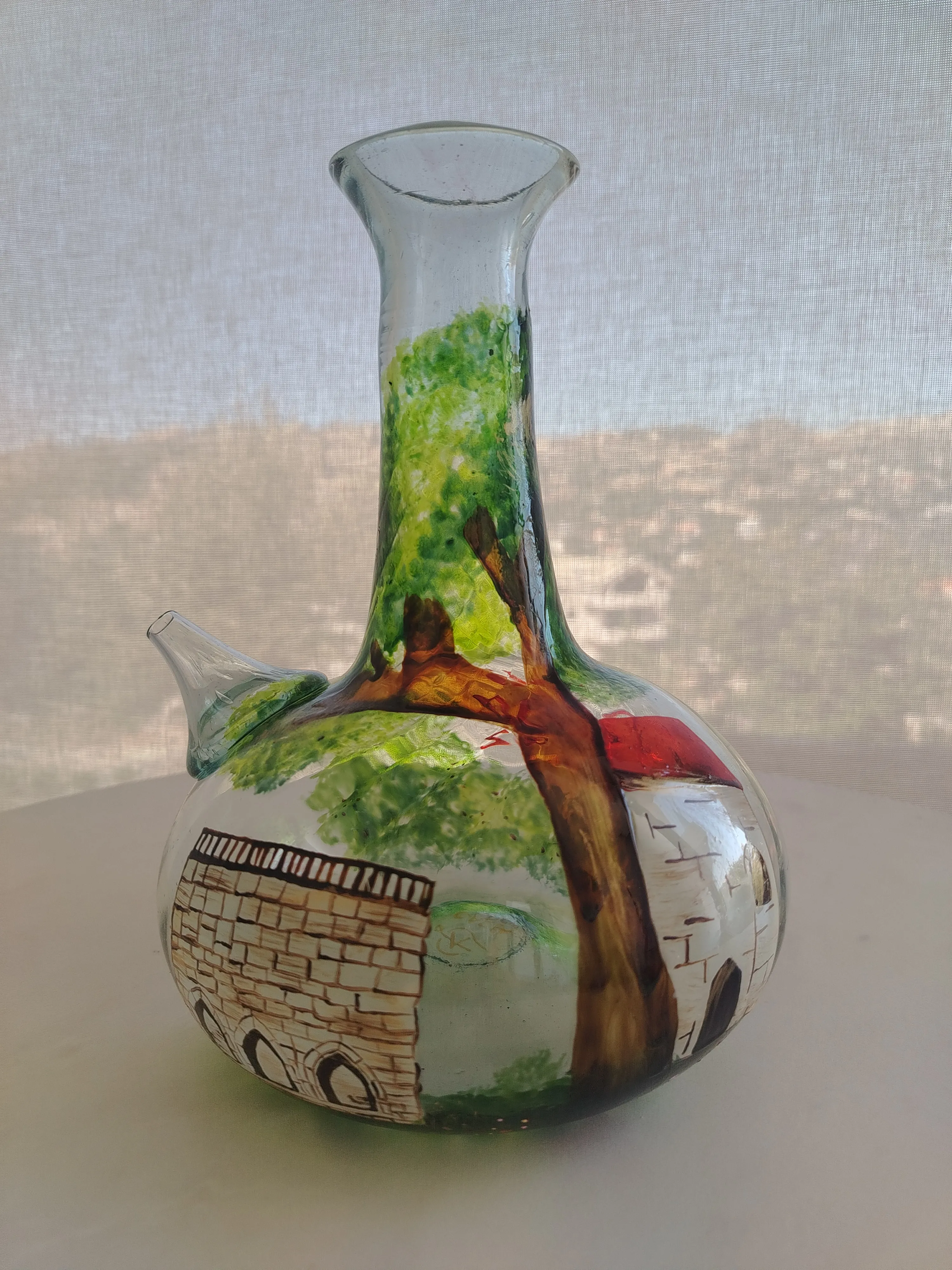 Lebanese village hand-painted onto glass, a tribute to the home Carla carries with her