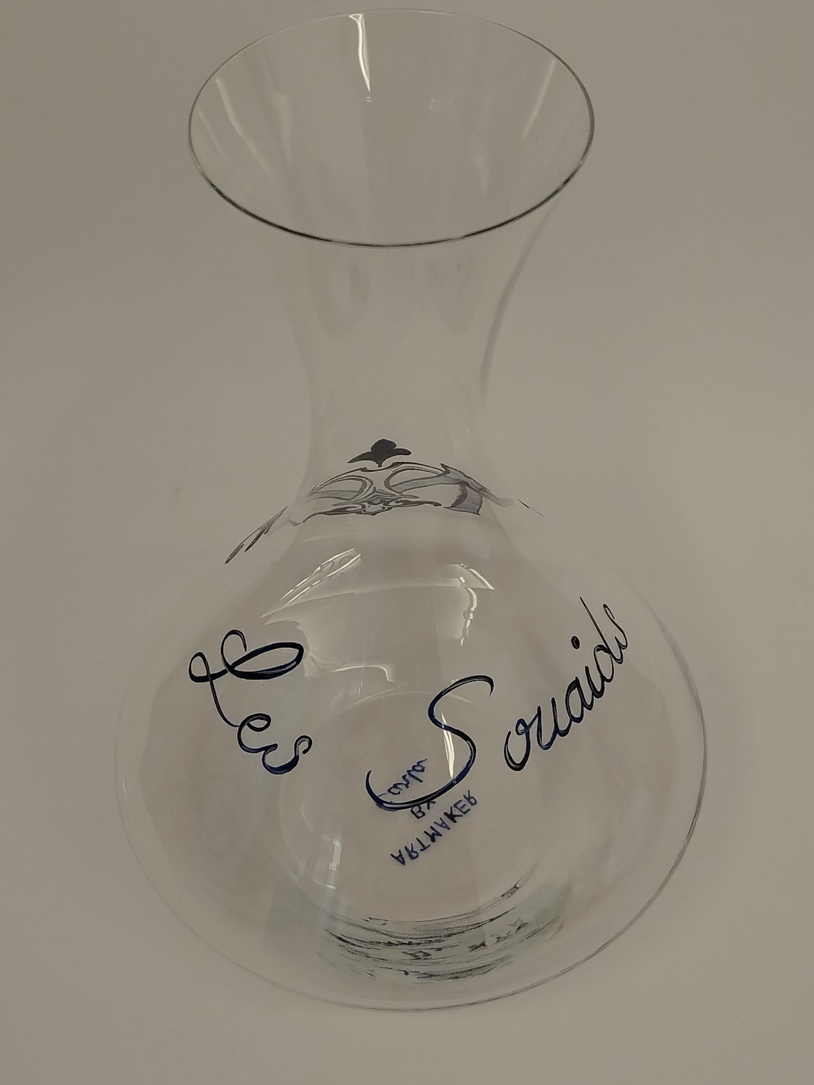 Hand-painted glass decanter with the Souaids family monogram in gold vitrail