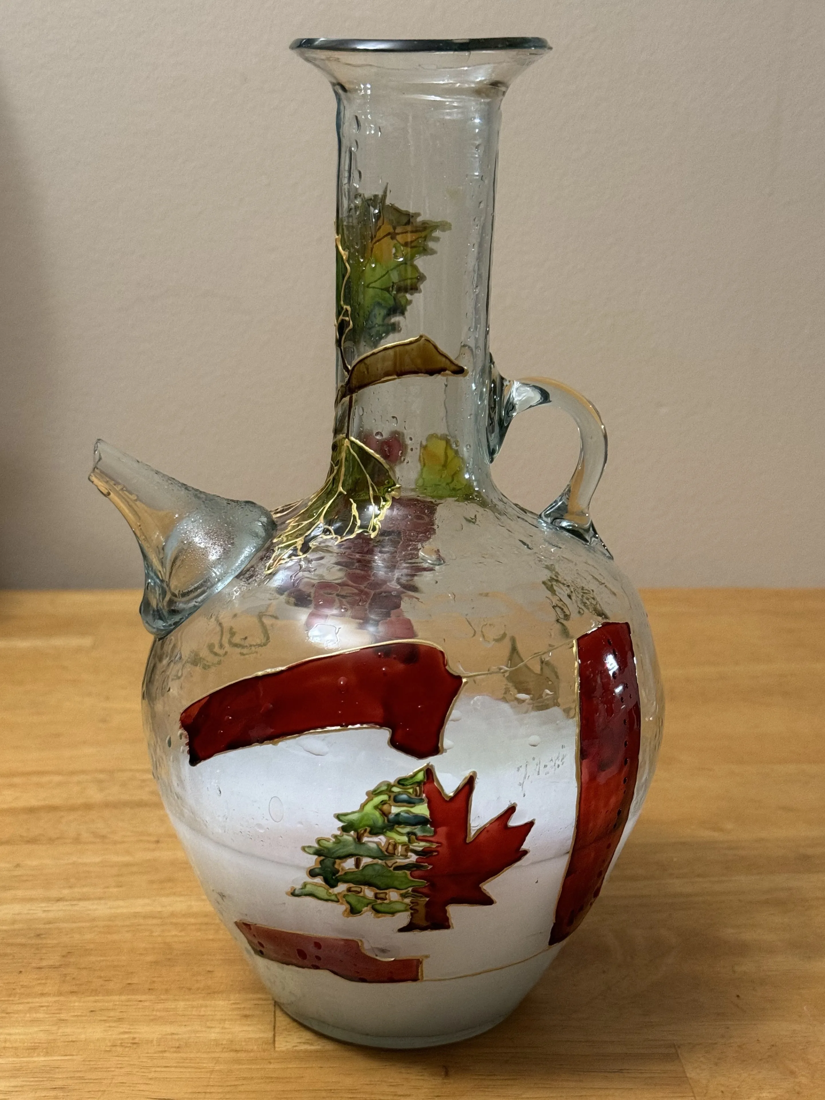 Hand-painted Lebanese glass jug with a rich grape and vine motif in deep purple and green, outlined in gold vitrail
